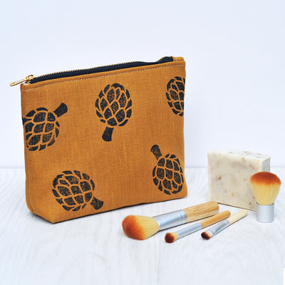Yellow linen make up bag with artichoke print 
