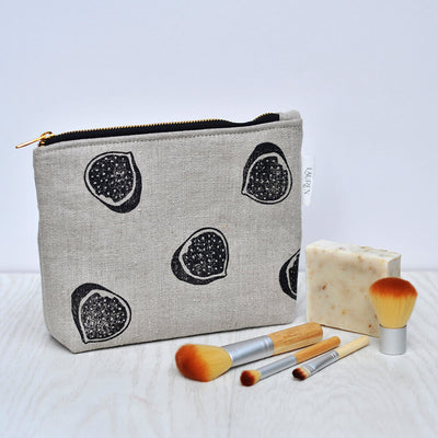 Natural linen make up bag in fig print with brushes and soap