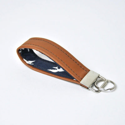 Recycled leather keychain in navy bird fabric